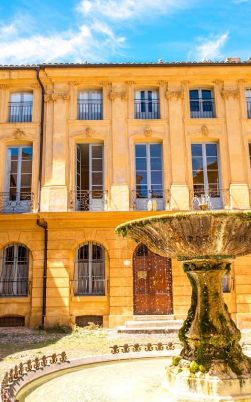 Beautiful old fountain on Albertas square in Aix-en-Provence old town in France. French architecture in Provence